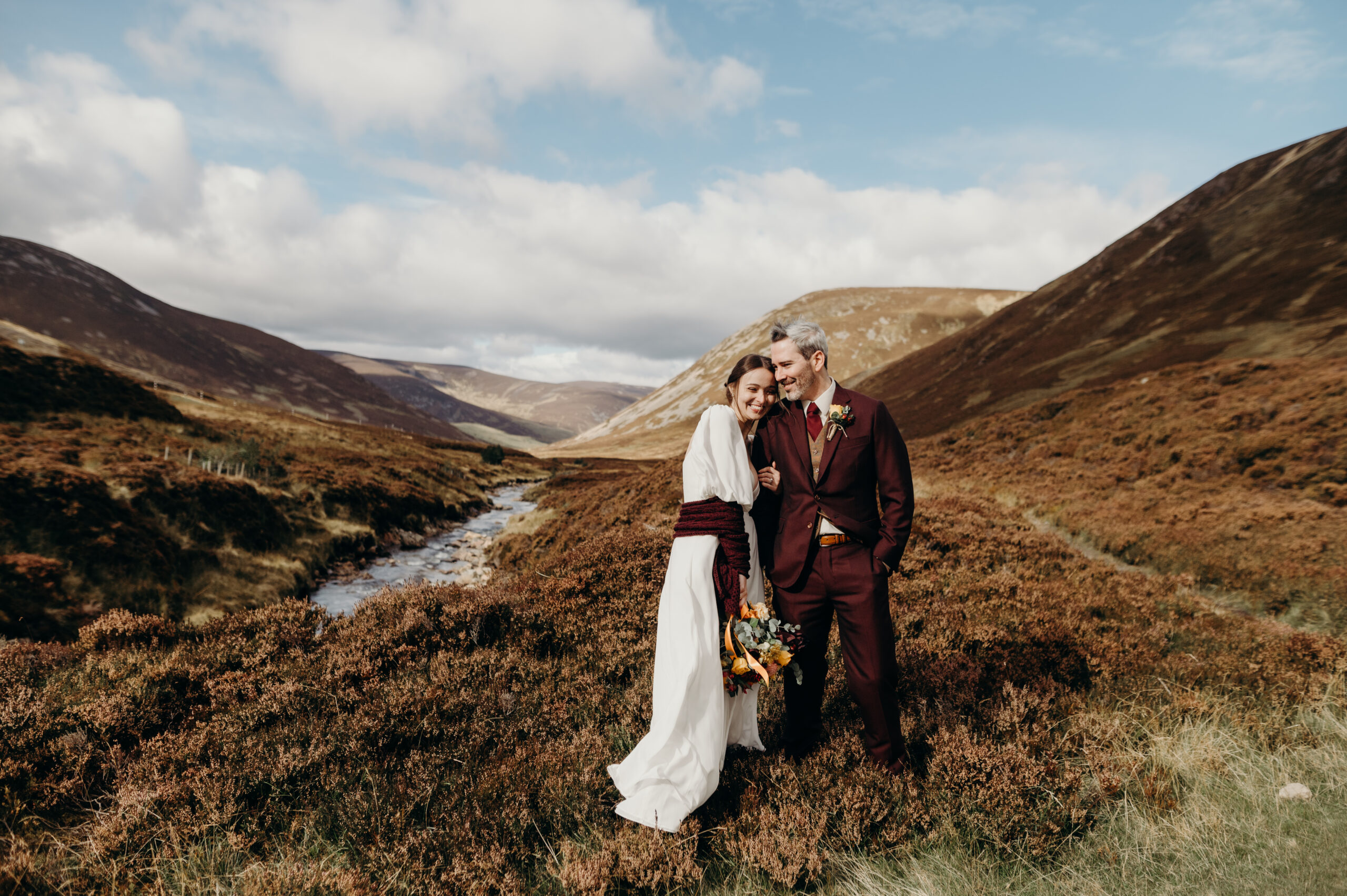 A bride and groom in the hills of Scotland